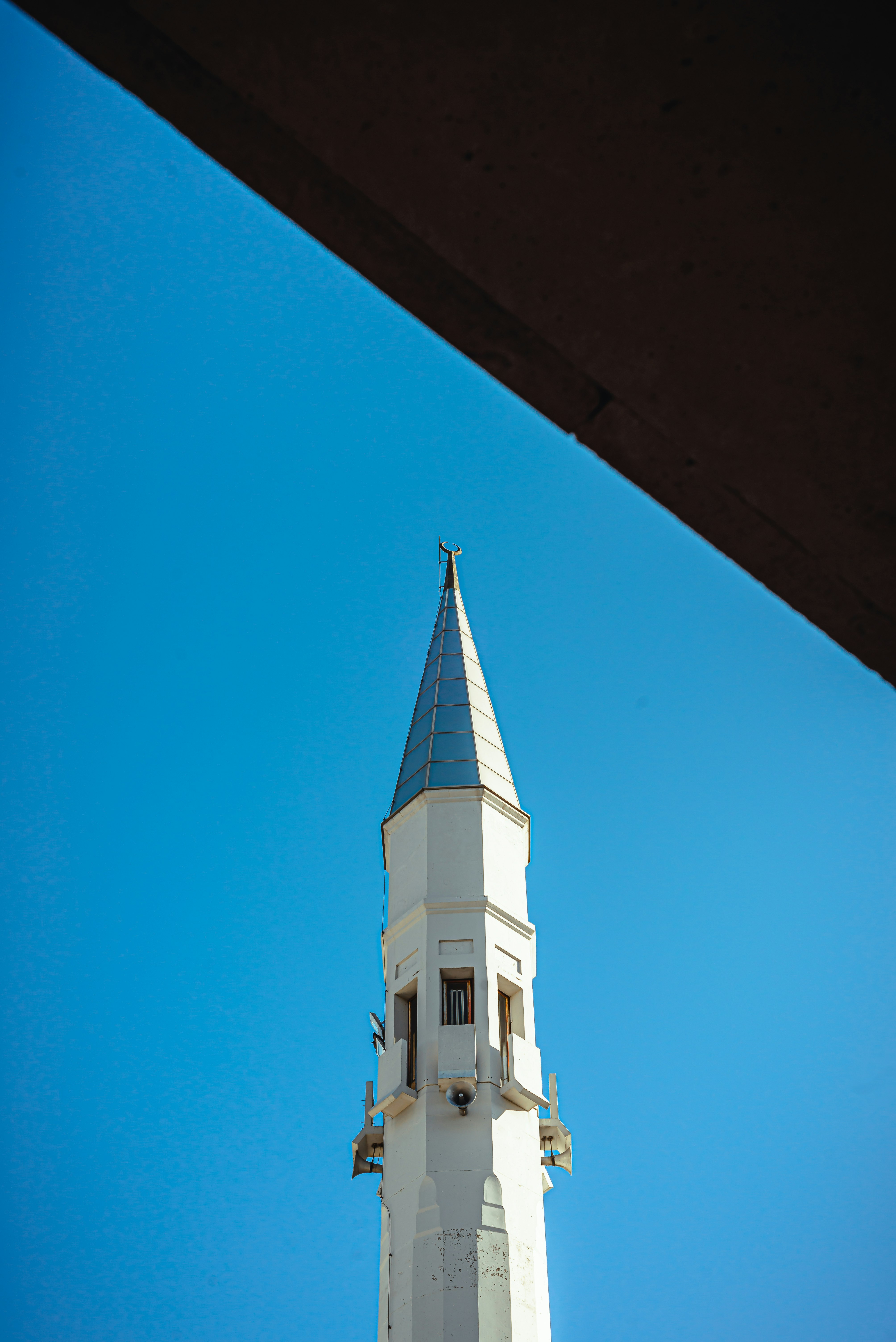 white and brown concrete building under blue sky during daytime